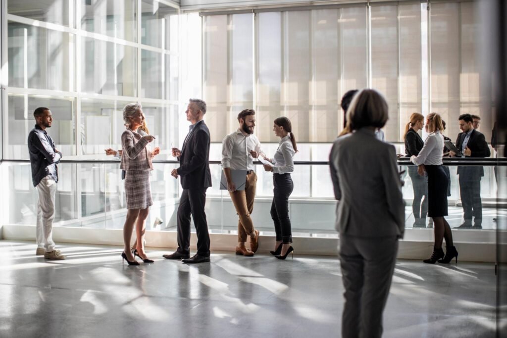 Diverse Professionals Engaging at a Dynamic Business Conference