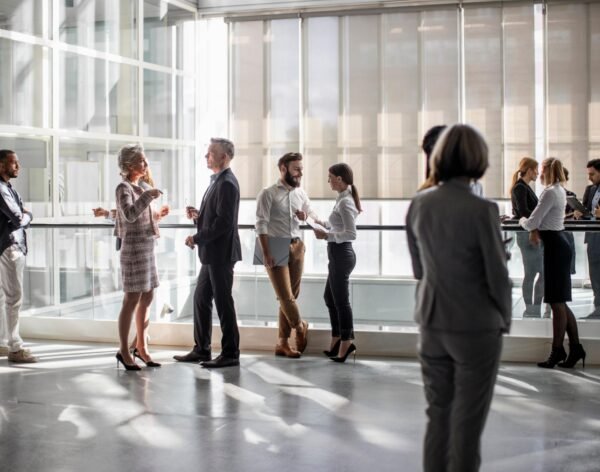 Diverse Professionals Engaging at a Dynamic Business Conference
