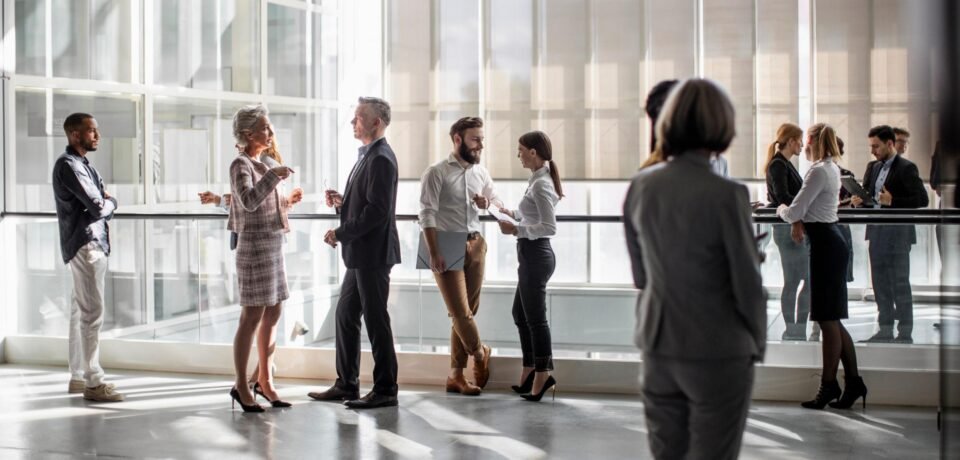 Diverse Professionals Engaging at a Dynamic Business Conference